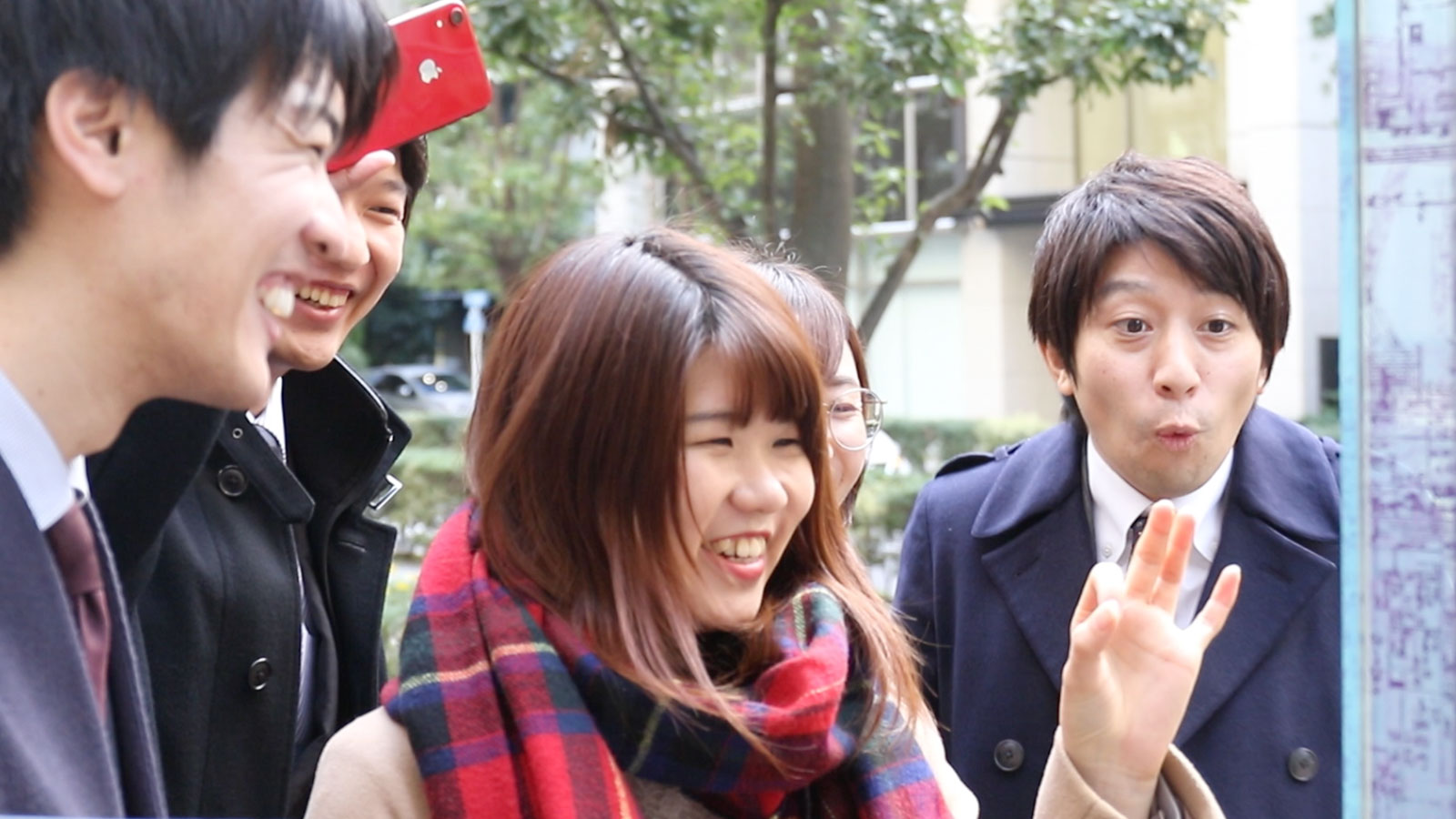 Japanese group interacting with digital ooh screen