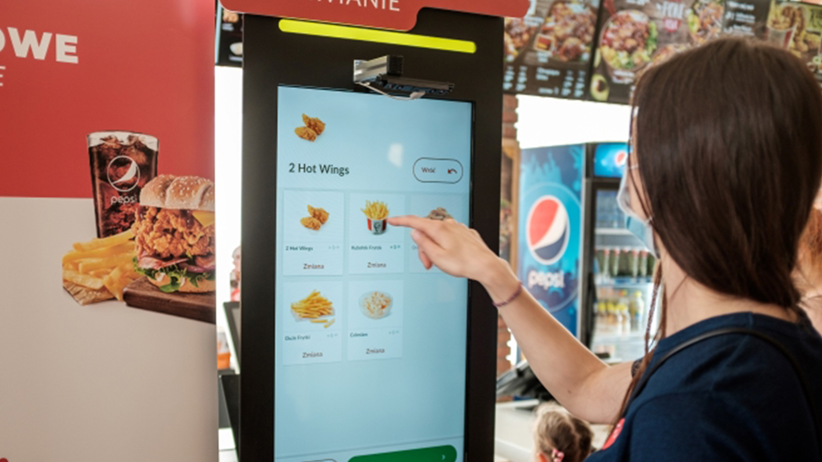 Fast food ordering with a touchless screen at KFC