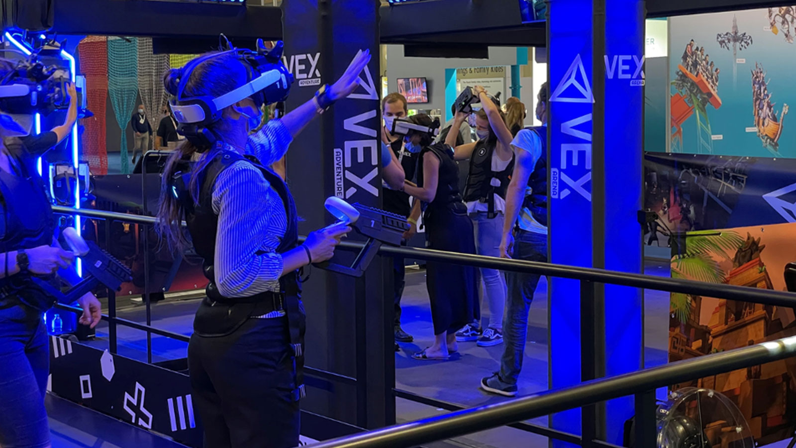 Users at a VEX vr arcade wearing headset with Ultraleap hand tracking